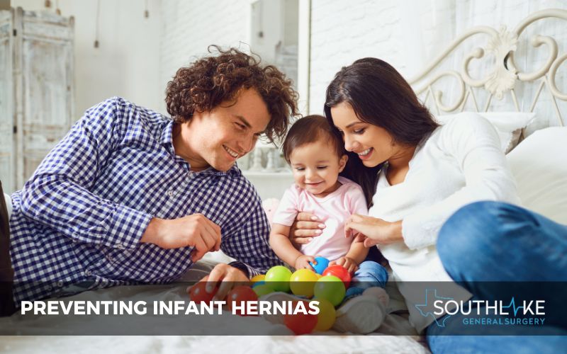 Healthy and happy baby playing, representing hernia prevention.