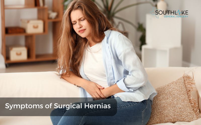 Patient holding their abdomen in pain, illustrating common symptoms of a surgical hernia.